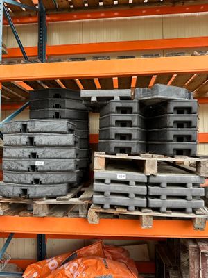 a stack of pallets on a pallet rack in a warehouse