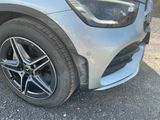 a close up of a car ' s tire on the ground