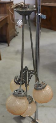 three lamps that are on a stand in a room