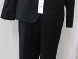 a black suit on a mannequin on a stand