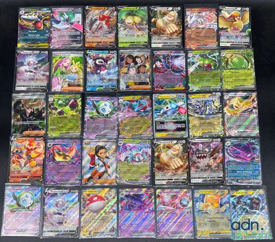 a large collection of pokemon cards are displayed on a table