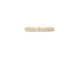a yellow gold ring with diamonds on a white background