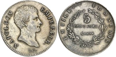 a silver coin with the head of a woman in profile