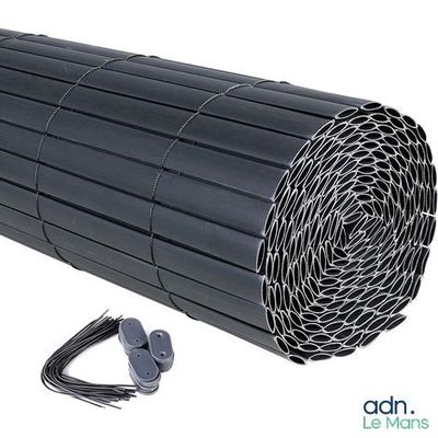 the black plastic tube is laying on the ground next to a pair of wires