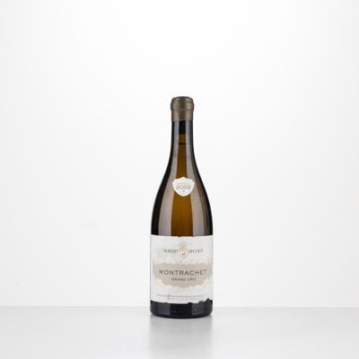 a bottle of white wine sitting on top of a table