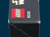 a box of legos sitting on a blue surface