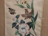 framed picture of a butterfly and flower with a butterfly on it