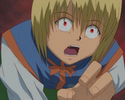 an image of a woman with blonde hair and red eyes pointing at something