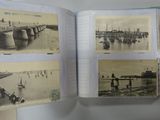 a person holding a book with pictures of boats in it