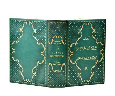 an old book with a green cover and gold writing on it