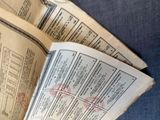 an open book that has a bunch of papers on it
