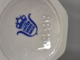 a small vase with a blue and white design on it