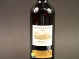 a bottle of wine that is sitting on a table
