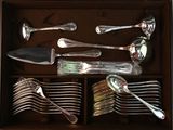 silverware in a wooden box with spoons and spoons in it