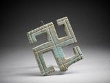 a close up of a piece of metal with squares on it
