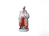 figurine représentant un homme et une femme en costume traditionnel