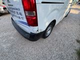 a white van that is parked in a parking lot