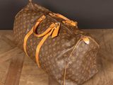 a louis vuitton bag sitting on a wooden floor