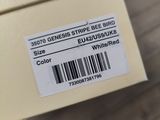 a close up of a box on a wooden floor with a barcode on it