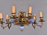 a chandelier that has a blue and gold design on it