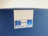 a blue box with a sticker on it