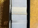 a box of cards sitting on a table in front of a wall