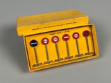 a close up of a yellow box with four different signs on it