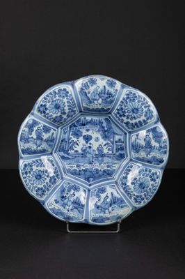 a blue and white plate with a floral design on it