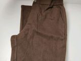 the pants are brown in color and have a small patch on the bottom