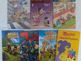 plusieurs livres pour enfants sont alignés sur une surface blanche
