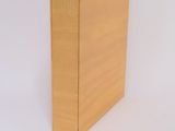 a wooden box that is sitting on a white surface