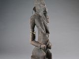 an image of a statue of a woman holding a pot on her head