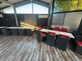 a table and chairs in a room with a large window