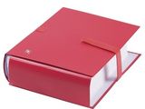 a red book with a red ribbon on top of it