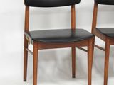 pair of mid century danish dining chairs with black leather upholstered seats