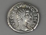 a close up of a silver coin with a woman on it