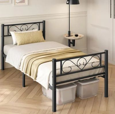 a bed with a metal frame in a room