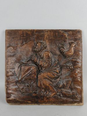carved wood plaque depicting a man and a woman in a boat