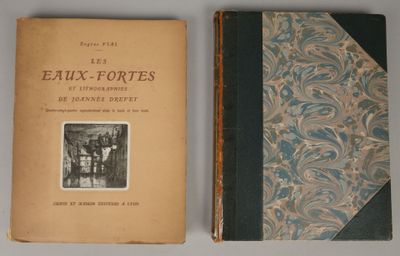an old book sitting on top of a table next to another book
