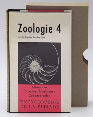 a book that is sitting on a table next to a box