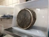 an image of a microwave with a basket on top of it