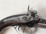 a close up of a gun that is on a table