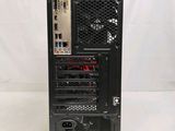 a black computer tower with a fan on top of it