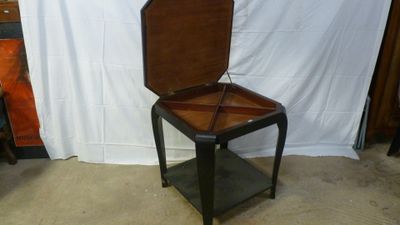 a small table with a mirror on top of it