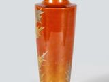 a vase that is sitting on a white surface