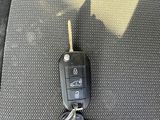 a picture of a car key on the seat of a car
