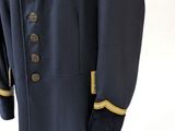 navy blue coat with gold trimmings and buttons on a mannequin