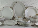 a lot of plates and bowls on a table