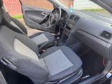 the interior of a car with the door open and the seats down
