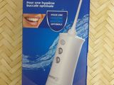 the box of the electric toothbrush is sitting on the table